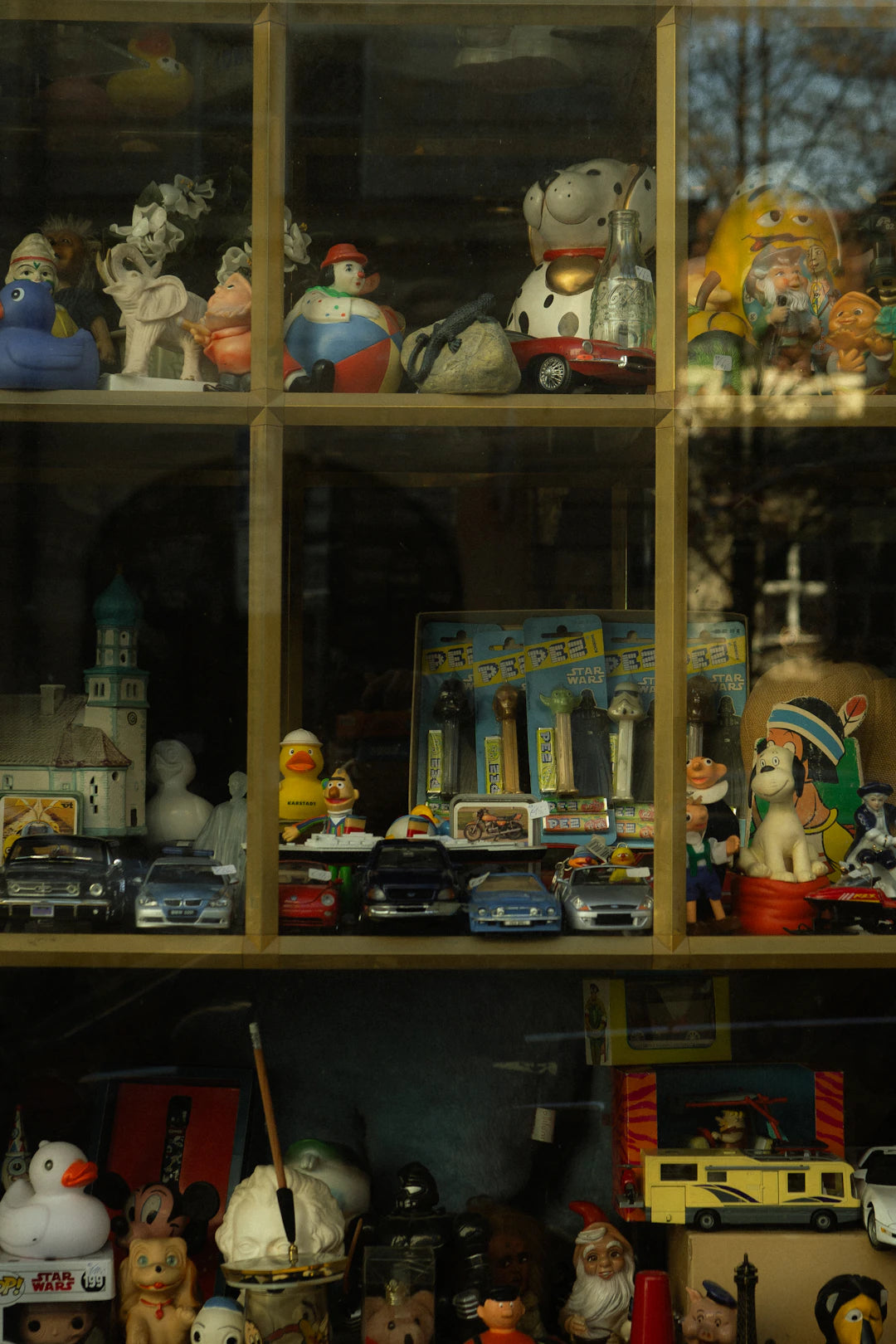 Cross-Collecting The Fusion of Tin Toys, Ceramics, and Vinyl