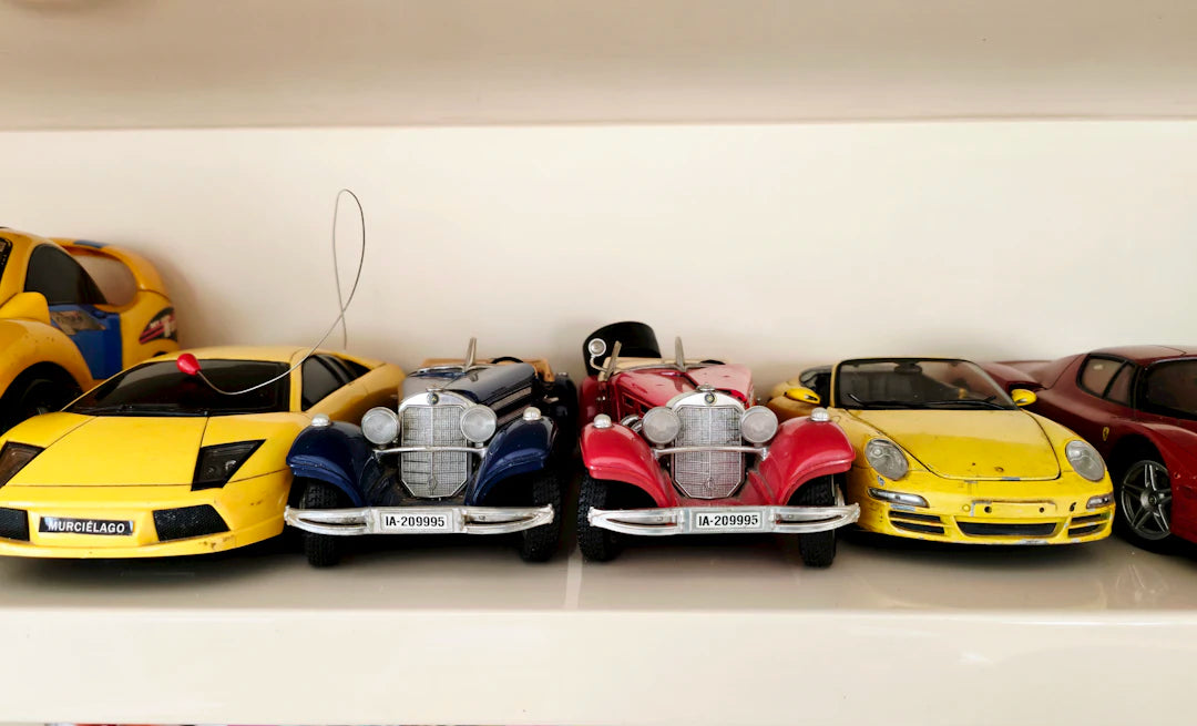 Charming Miniature Tin Cars and Toys for Display and Play