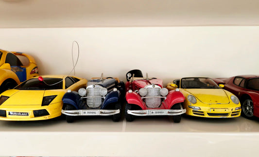 Charming Miniature Tin Cars and Toys for Display and Play