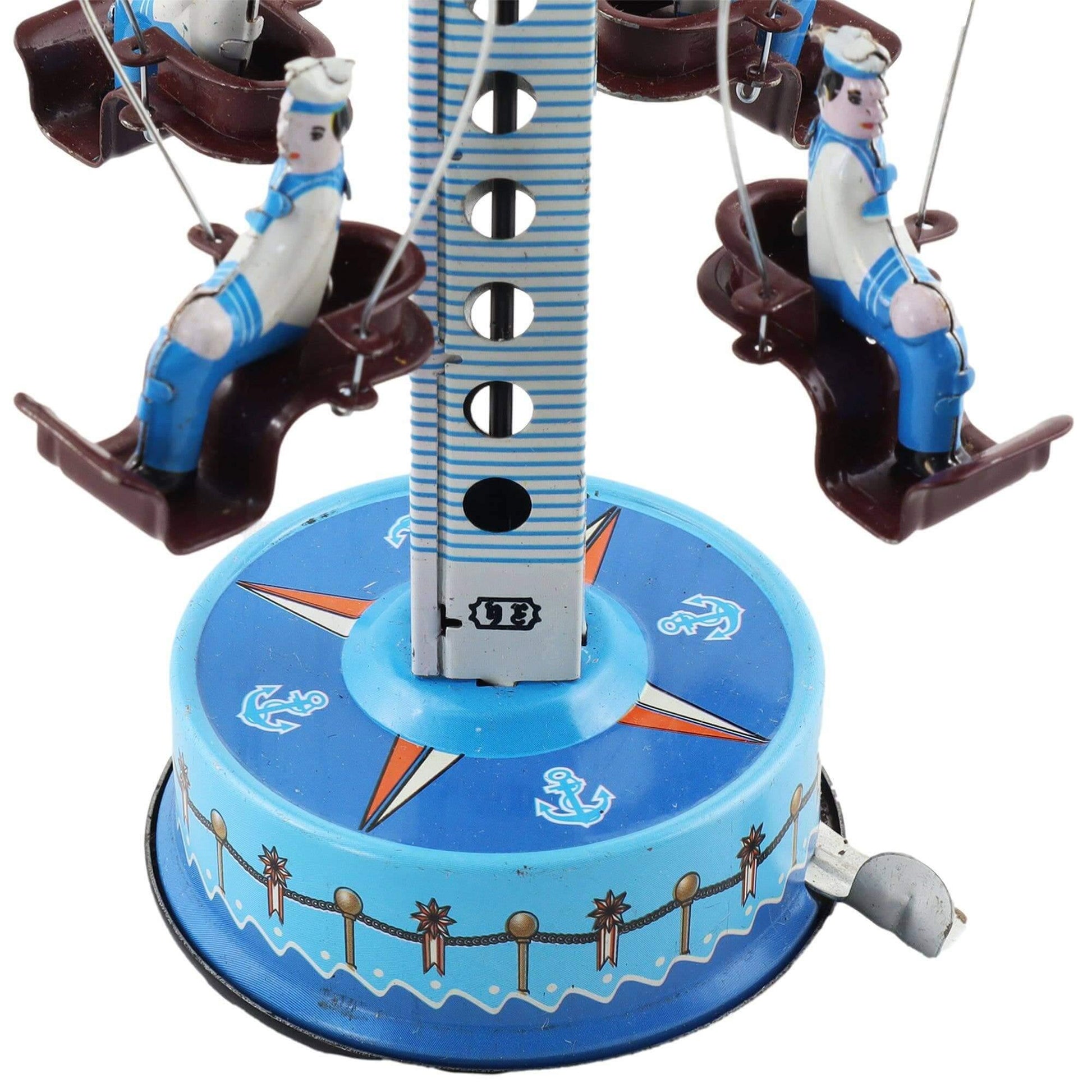 Met de hand opgewonden blikken carrousel Matrozen – Nostalgisch oud speelgoed met zeevaartmotieven.