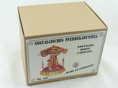 Blech Pferdekarussell – nostalgisches Sammlerstück aus Metall in einer dekorativen Verpackung.